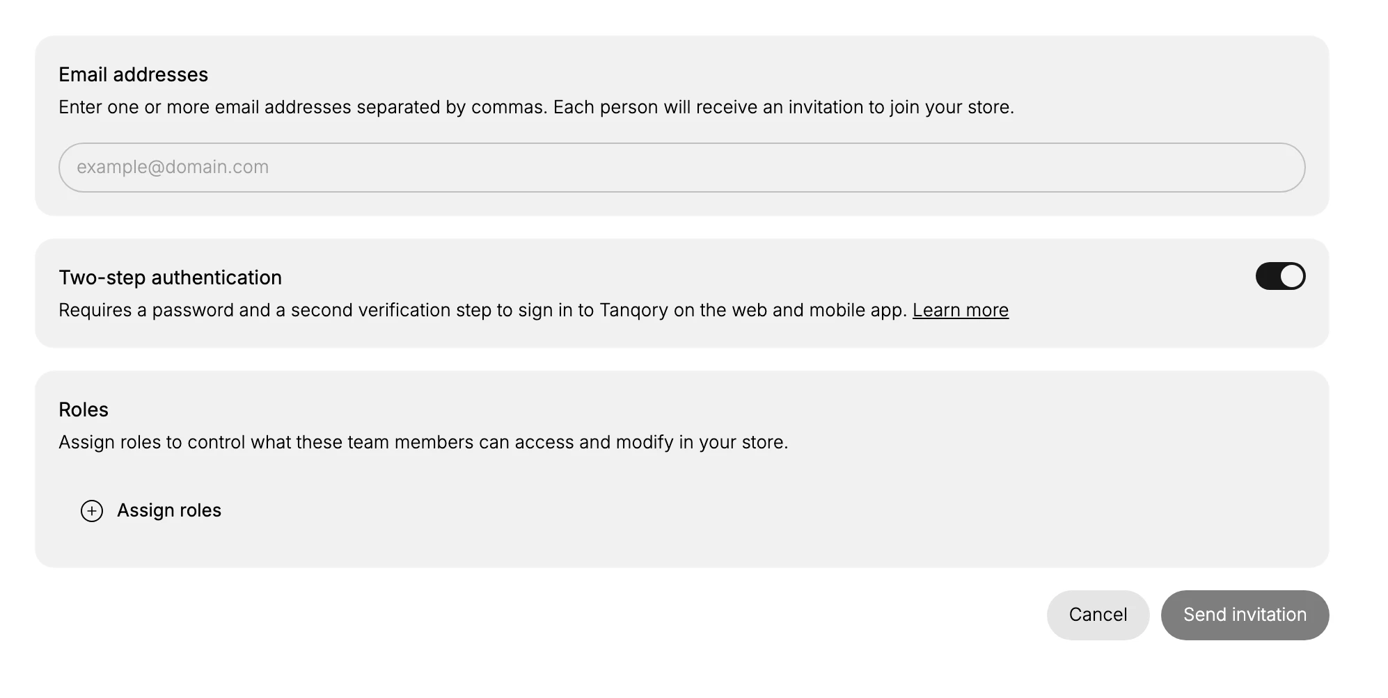 The Add team members form with the Email addresses field, the Two-step authentication toggle, the Roles section with the Assign roles control, and the Cancel and Send invitation buttons