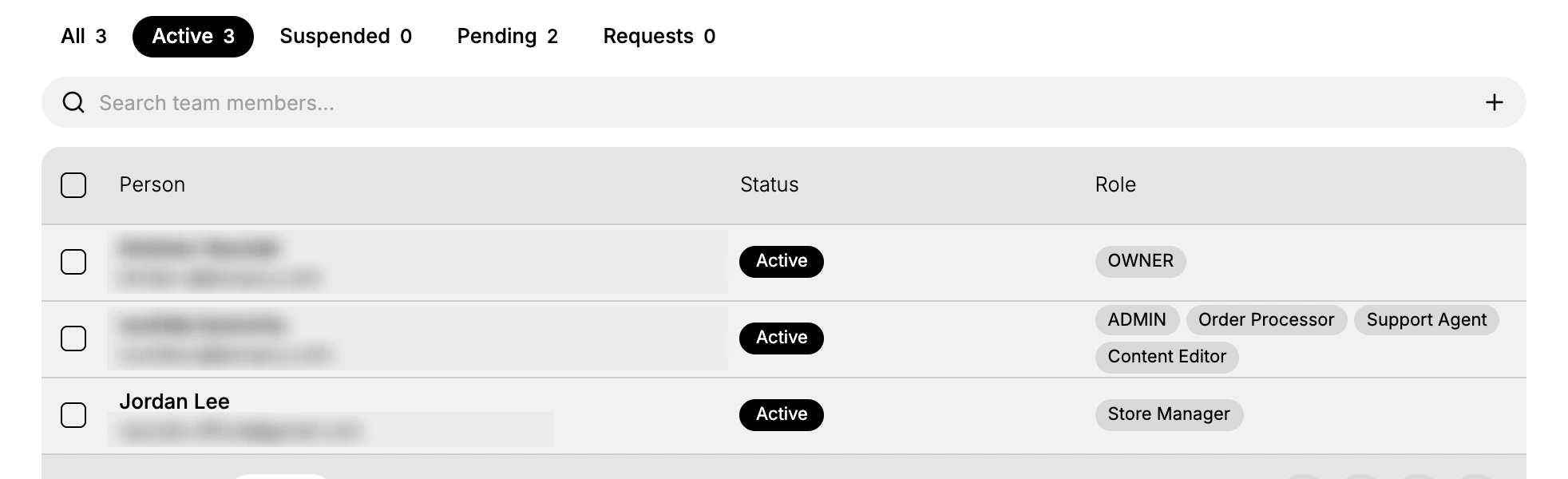The Active tab of the Users page, showing three members with their Status and the roles each one holds in the Role column