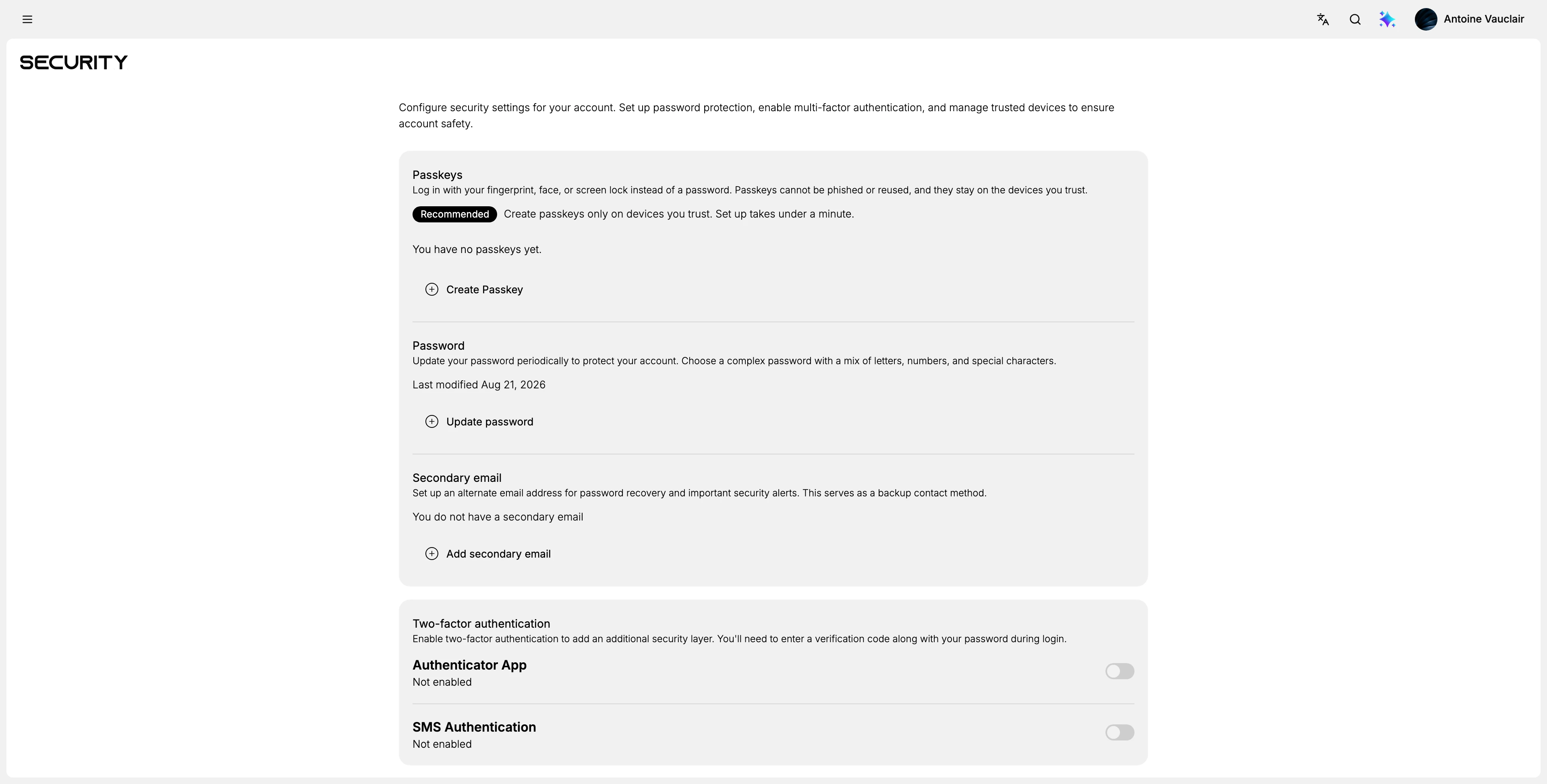 The account Security page, headed Security, with four sections down it: Passkeys with a Create Passkey button and a Recommended label, Password with an Update password button, Secondary email with an Add secondary email button, and Two-factor authentication listing Authenticator App and SMS Authentication