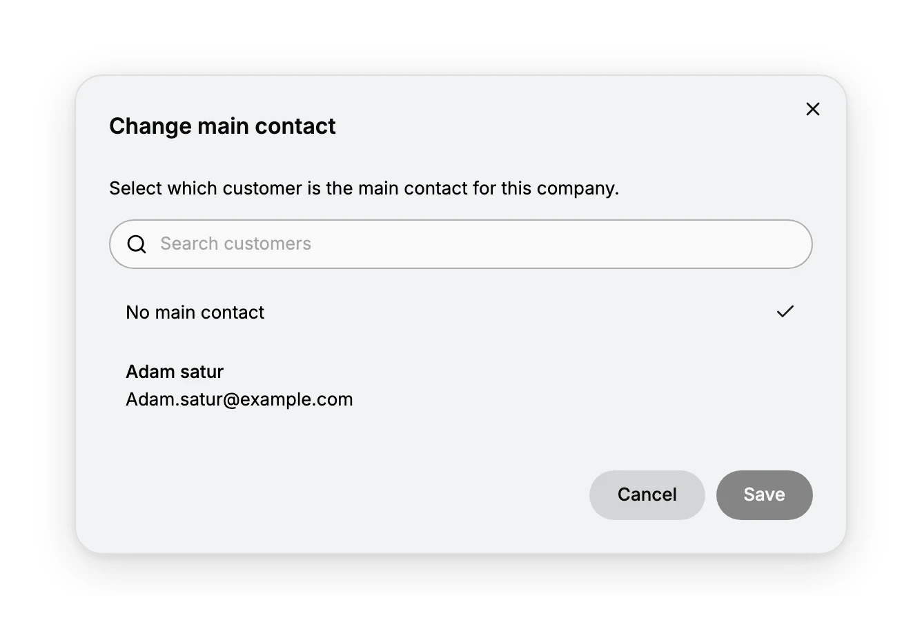 The Change main contact dialog, reading Select which customer is the main contact for this company, with a Search customers box, a No main contact option carrying the current tick, and the company's customer Adam satur listed with his email, above Cancel and Save.