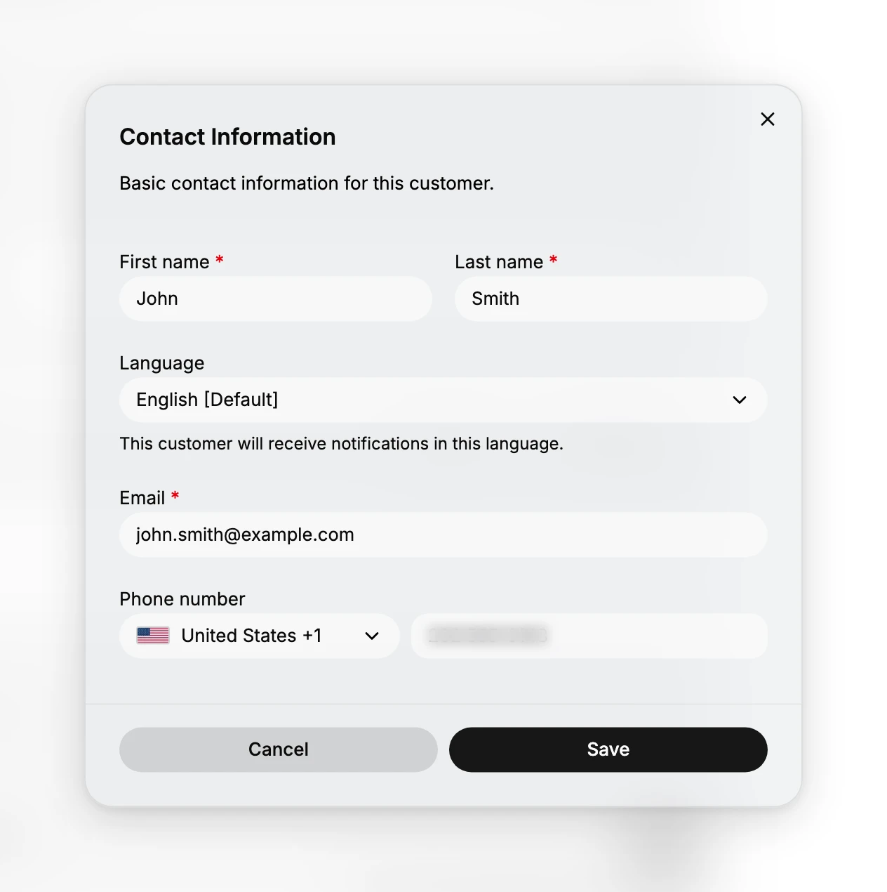 The Contact Information dialog. Under the line Basic contact information for this customer are First name and Last name, both marked required, a Language dropdown reading English Default with the note that the customer will receive notifications in this language, a required Email, and a Phone number with a country selector reading United States +1 beside the number itself, blurred here. Cancel and Save sit at the foot