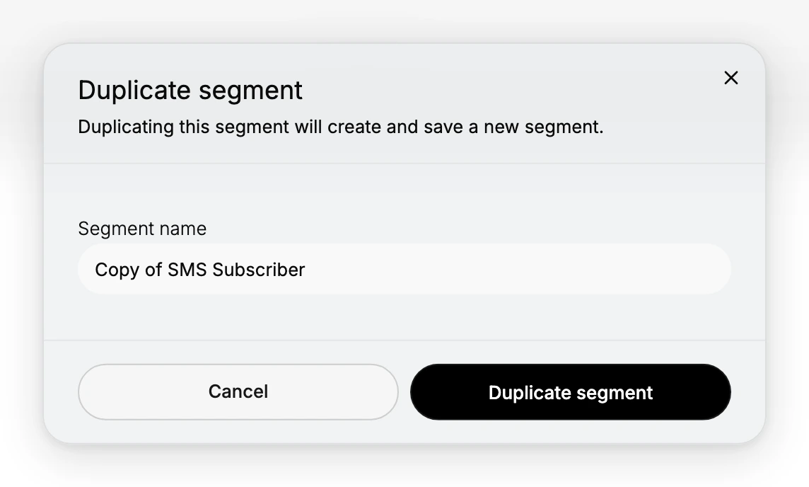 The Duplicate segment dialog. It is headed Duplicate segment and reads, Duplicating this segment will create and save a new segment. Below is a Segment name field already filled in with Copy of SMS Subscriber, and at the foot are Cancel and a black Duplicate segment button, with a close cross in the top corner