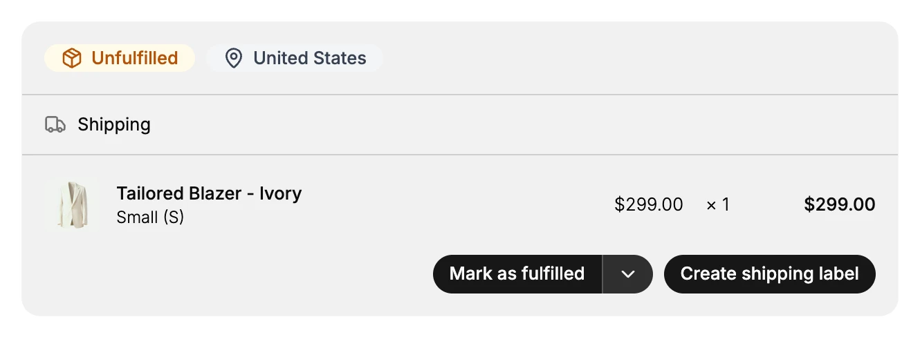 The fulfillment card on an order: an Unfulfilled status badge and the destination United States in the header, a Shipping delivery method, the line item Tailored Blazer - Ivory in Small (S) priced at $299.00 for a quantity of 1, and the Mark as fulfilled button with its dropdown and a Create shipping label button.