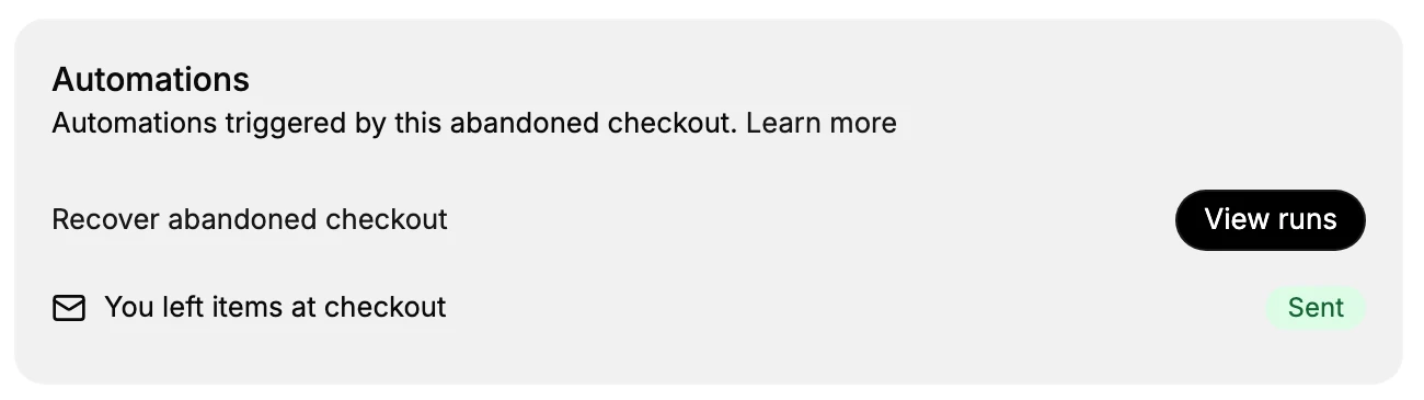 A close-up of the Automations card: the Recover abandoned checkout row with a View runs button, and the You left items at checkout email marked Sent
