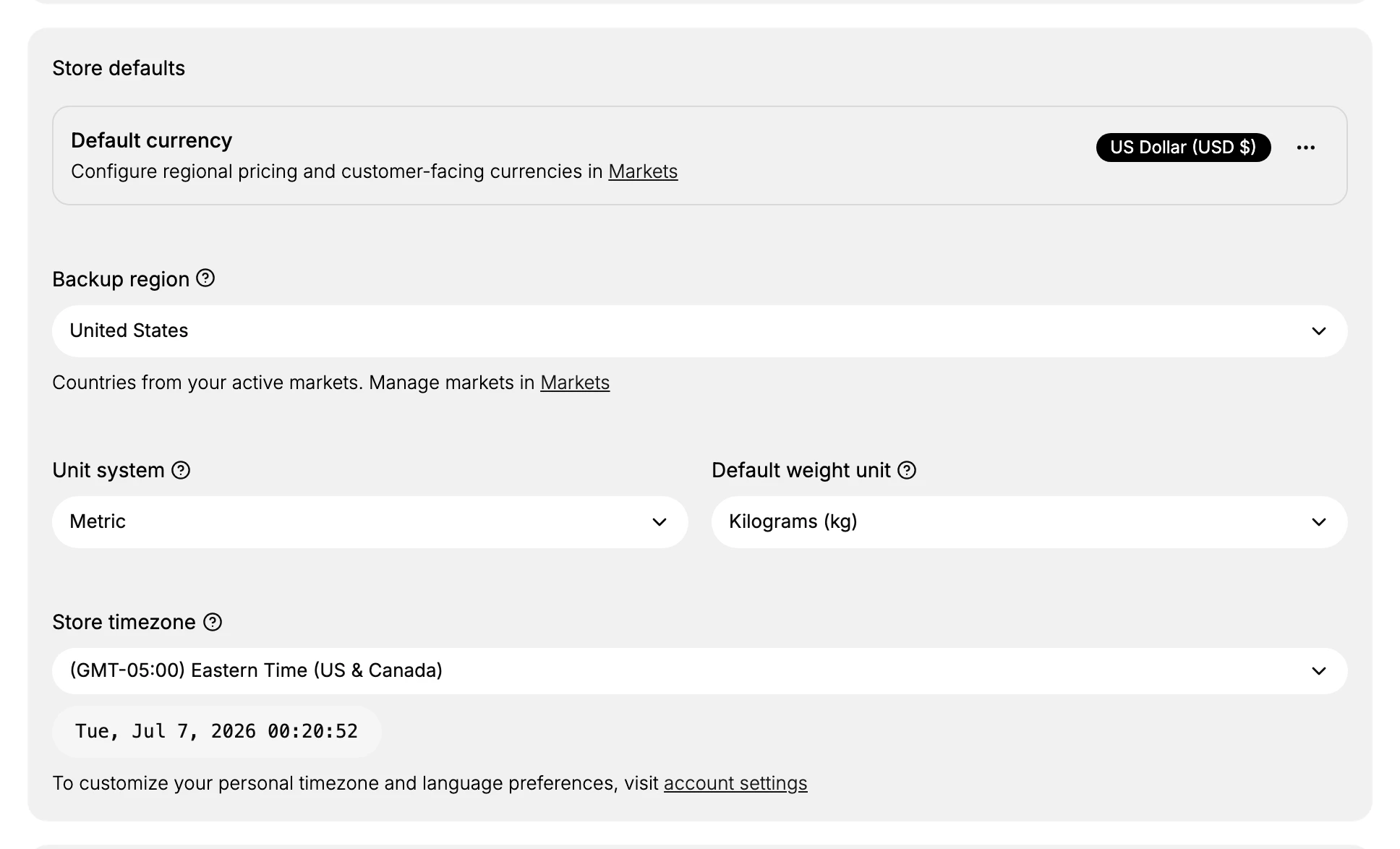The Store defaults section showing Default currency set to US Dollar, Backup region United States, Unit system Metric, Default weight unit Kilograms, and Store timezone Eastern Time.